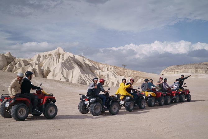 An adventurous ATV tour in Cappadocia, showcasing riders exploring the stunning landscape on quadbikes.